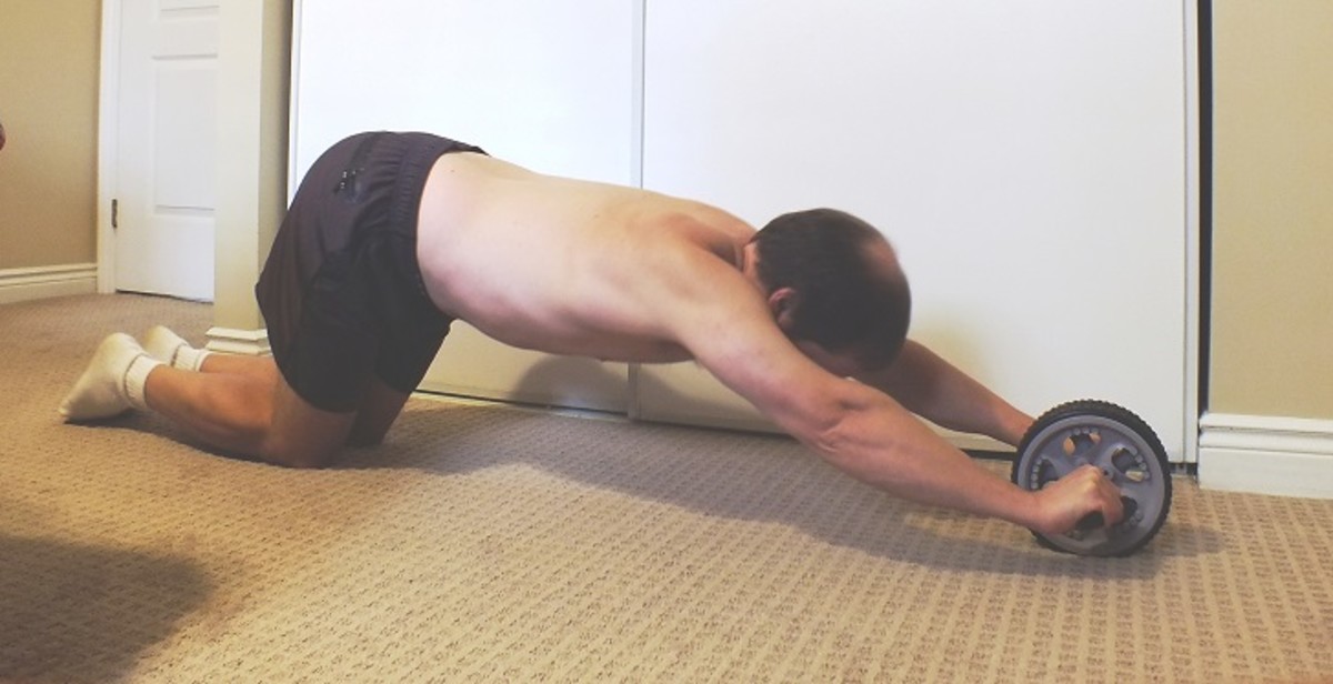 Ab rollout on knees using an ab roller.