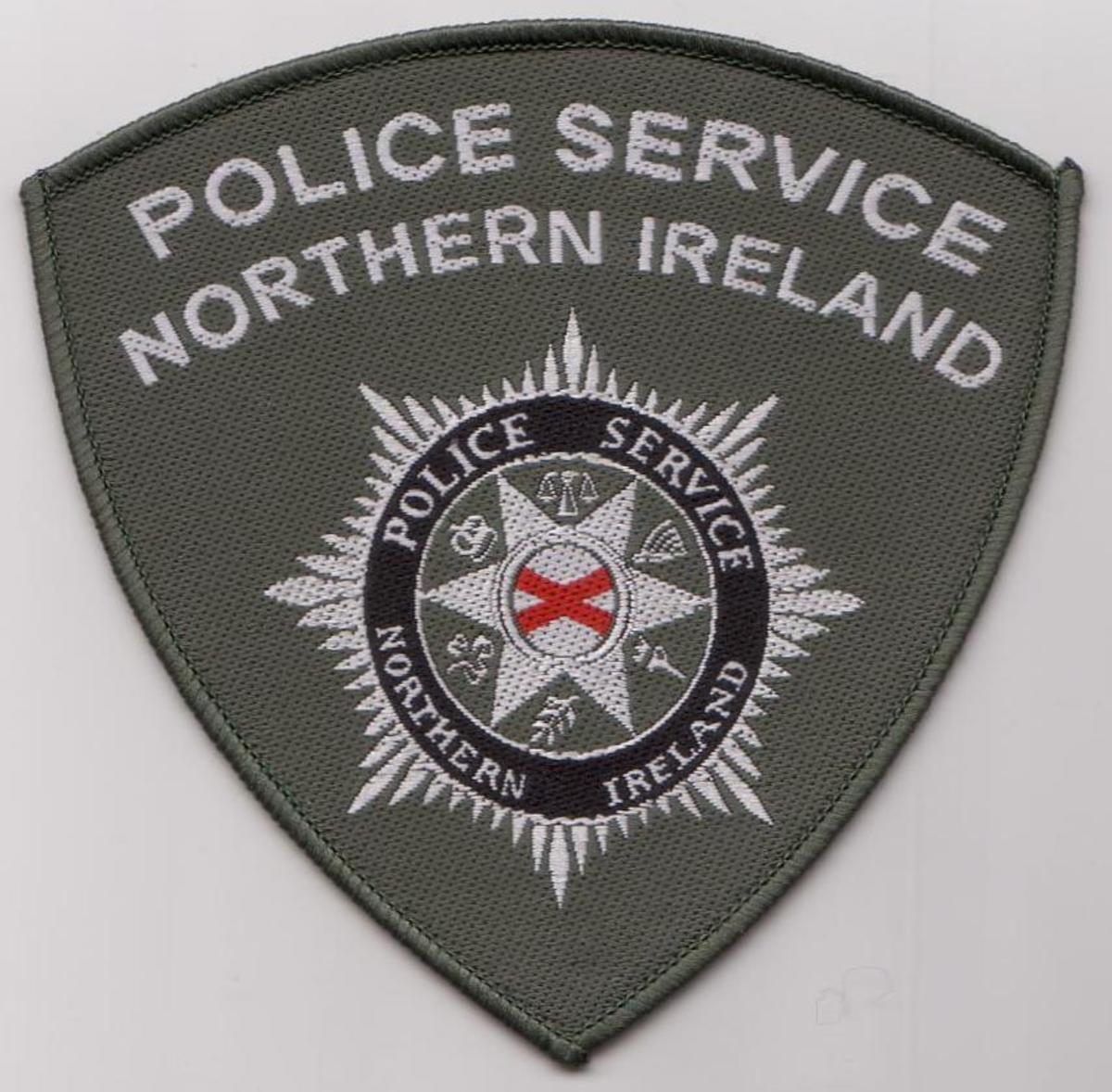 The badge for the new Police Service of Northern Ireland carefully includes six symbols to give a balanced representation of Northern Ireland.