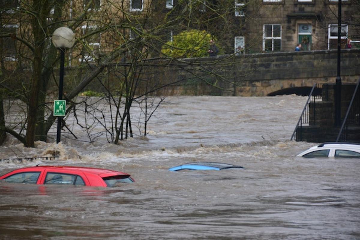 Cars flooded in disaster-prone area.
