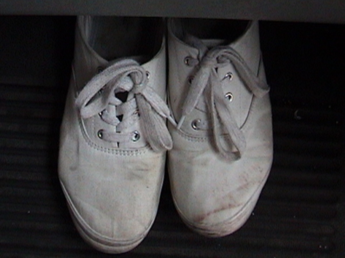 Worn shoes may indicate poverty or just an attachment to a comfortable pair of shoes.