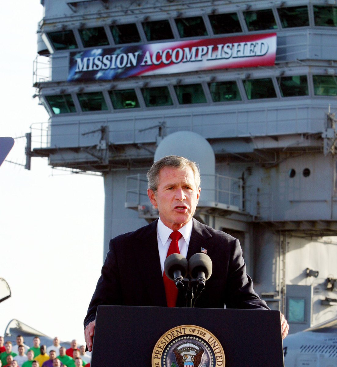 President Bush stands aboard the USS Abraham Lincoln to deliver his Mission Accomplished speech.