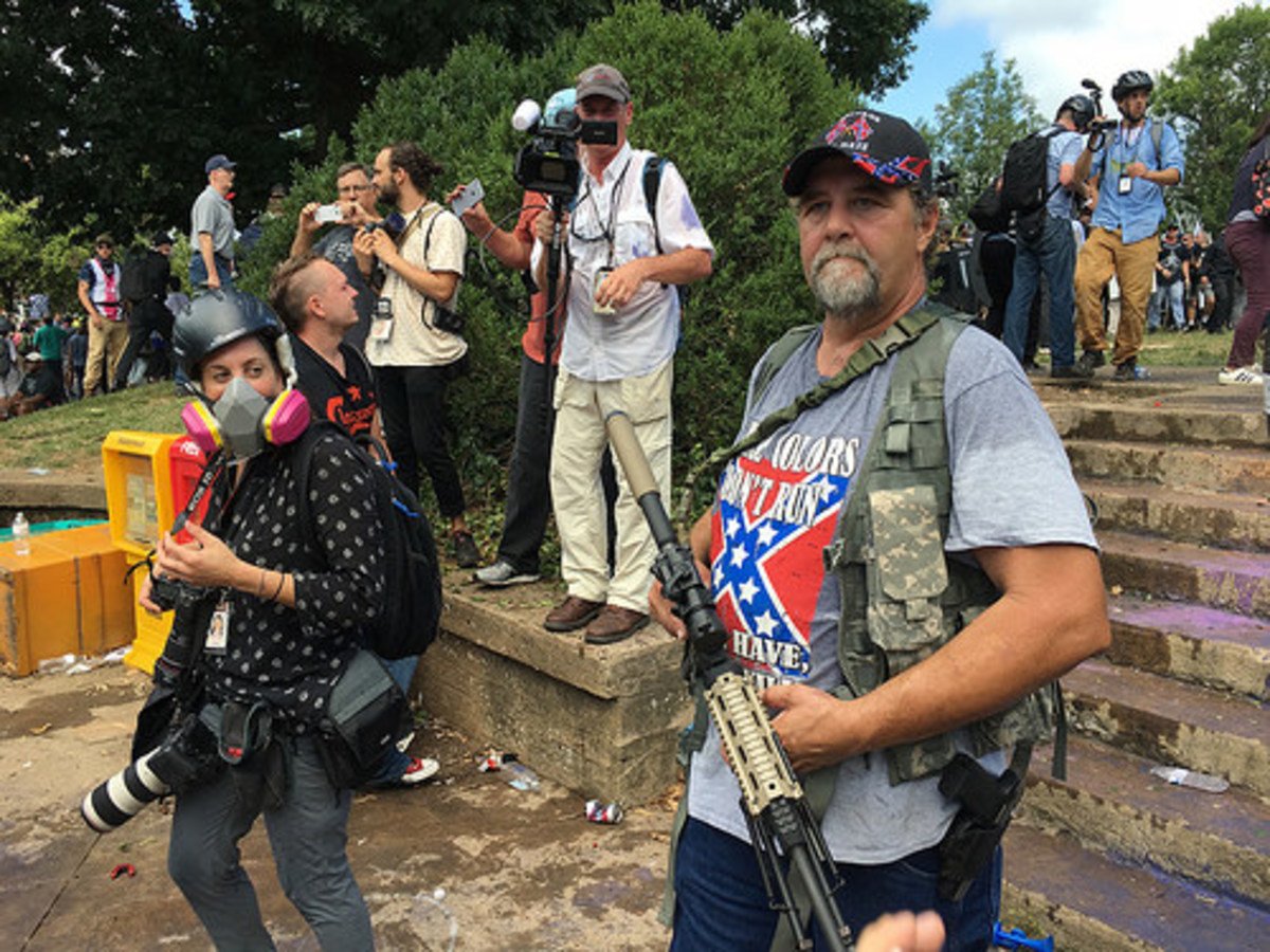 A man wearing a Confederate flag t-shirt