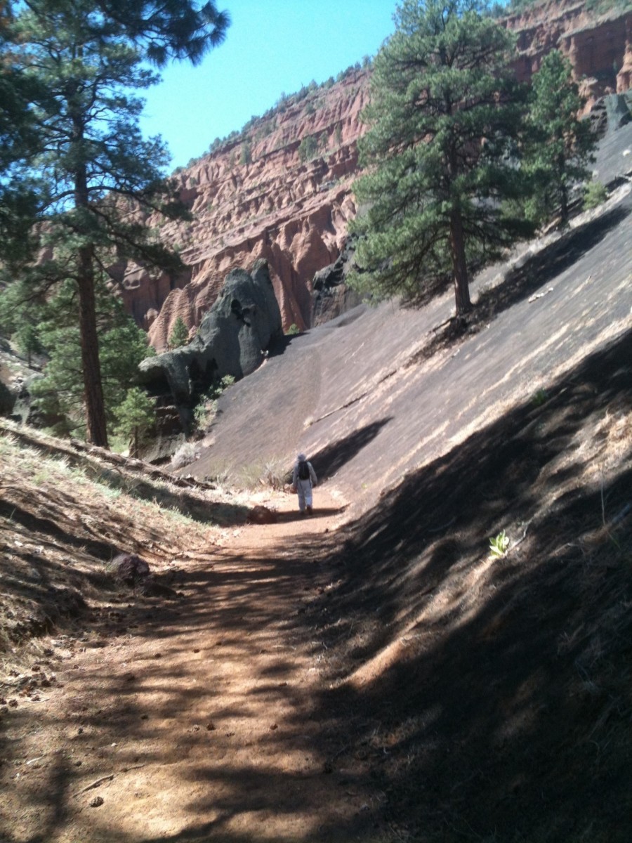 Hiking the trail and getting close to the amphitheater. Notice the lava cinders on the right. Hiking the trail and getting close to the amphitheater. Notice the lava cinders on the right.