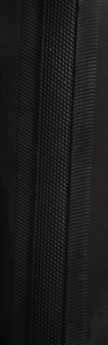 The Schwalbe Lugano tread pattern features a traditional file tread combined with directional arrowing sides