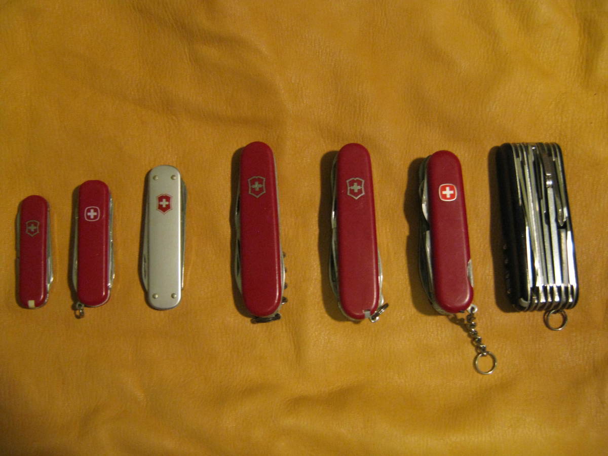 A few Swiss Army Knives from my collection, notice the thick Swiss Champ on the far right.  