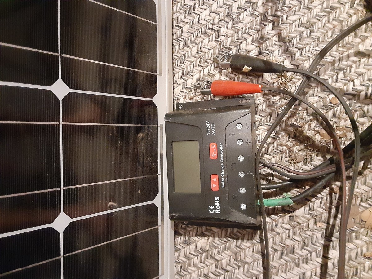 Attach the battery leads and charge controller to the solar panels. 