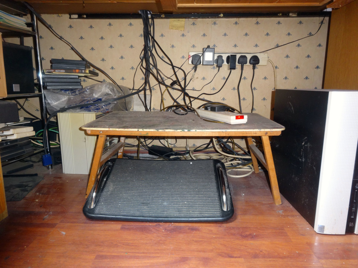 Cables tangled up on the floor before I installed the cable management trough.