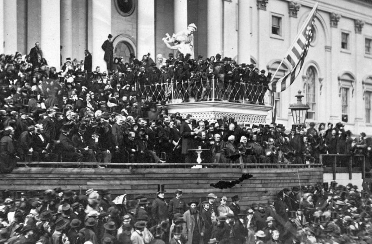 Abraham Lincoln's second inaugural. John Wilkes Booth is thought to be the hatless man on the balcony above Lincoln (center) and to his left.