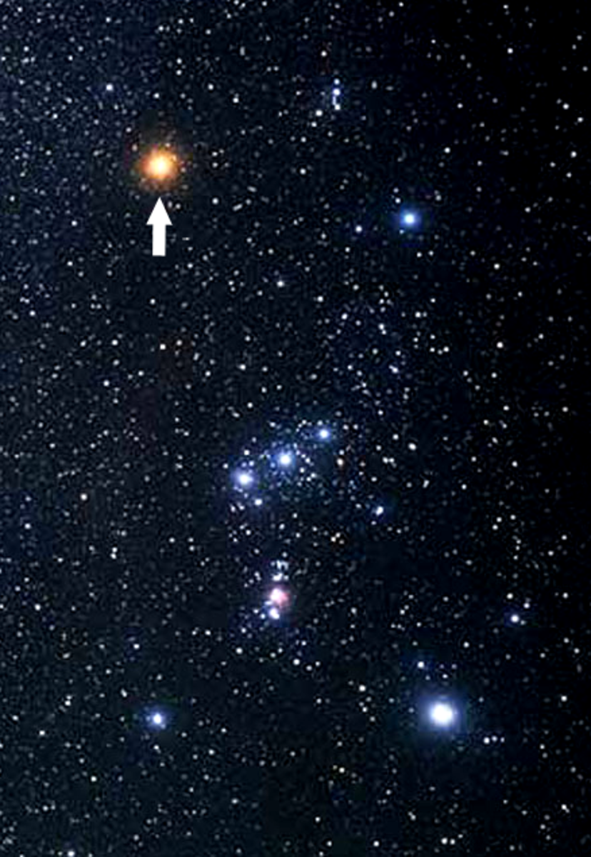 The arrow is pointing to Betelgeuse, showing the star's position in Orion.