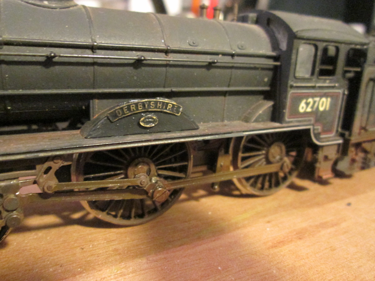 Close-up of left side wheel splasher with etched brass name and build date attachments, cab and cabside numbering on the right. The model is an old (1980's) Hornby double-O Gauge, 1/72 scale representation with additional detailing and 'weathered'