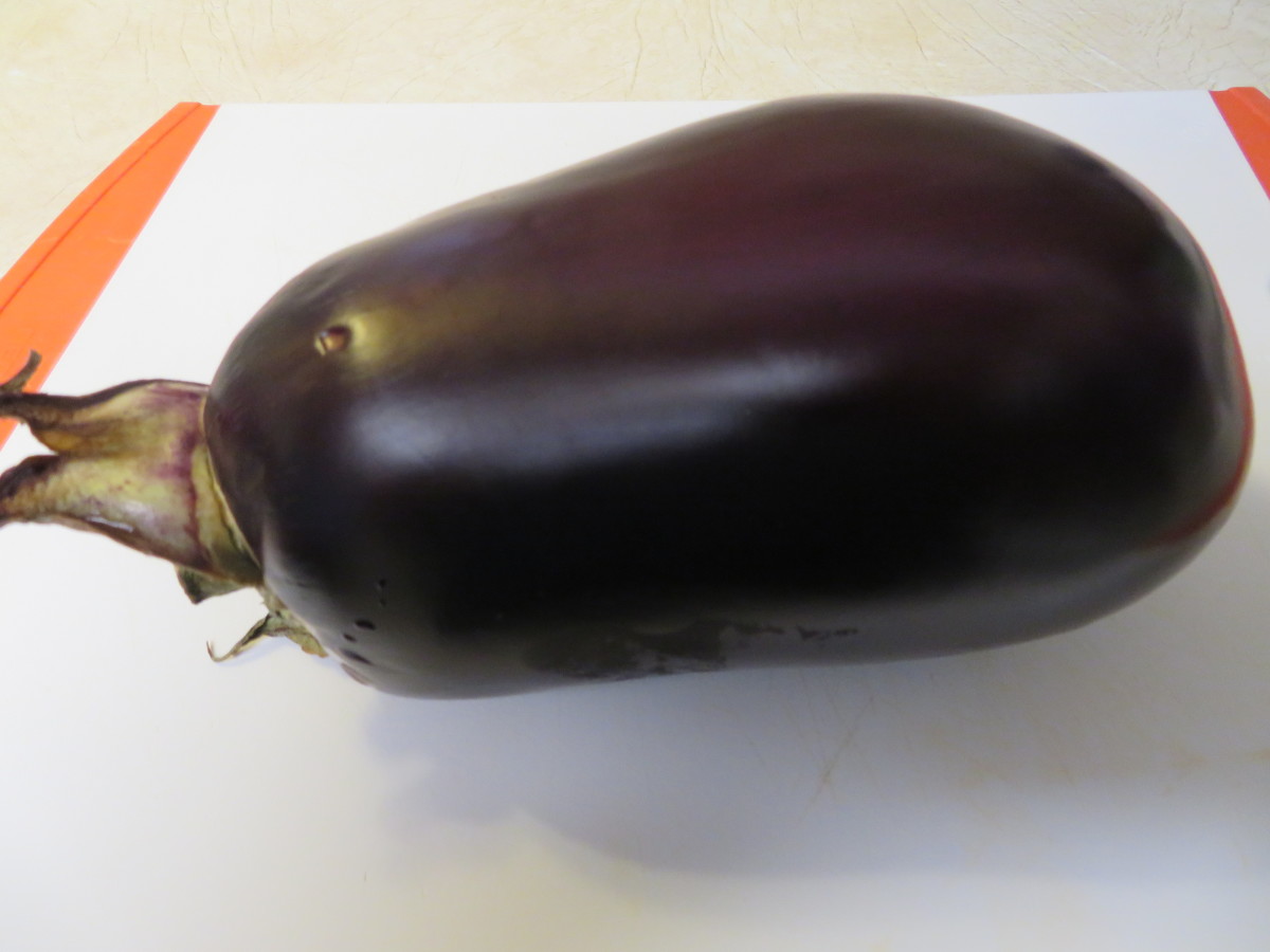 One large globe-shaped eggplant