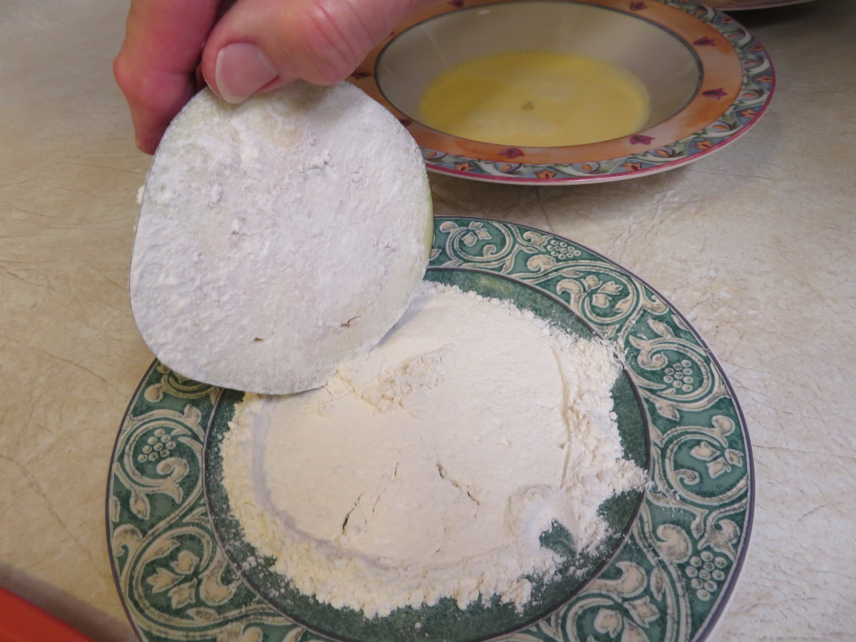 First dip the slice into the flour.