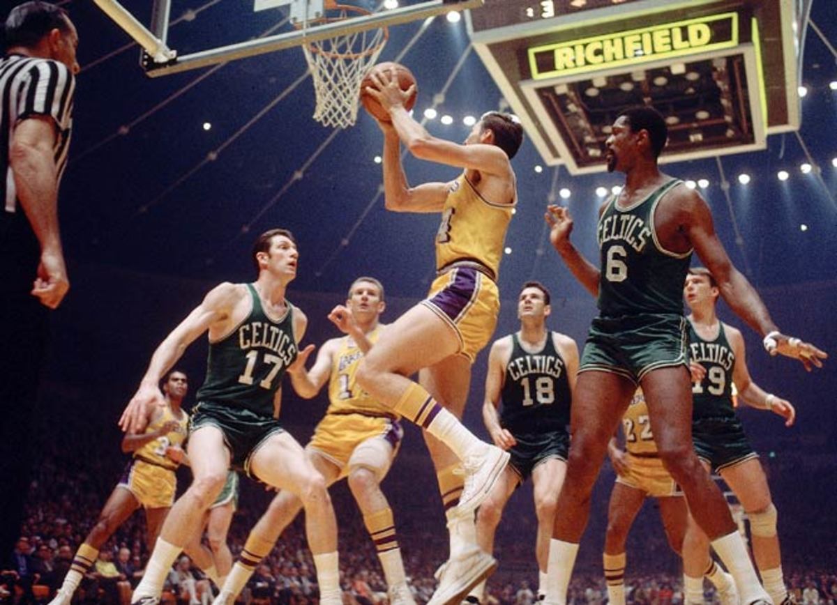 Jerry West drives to basket against Bill Russell