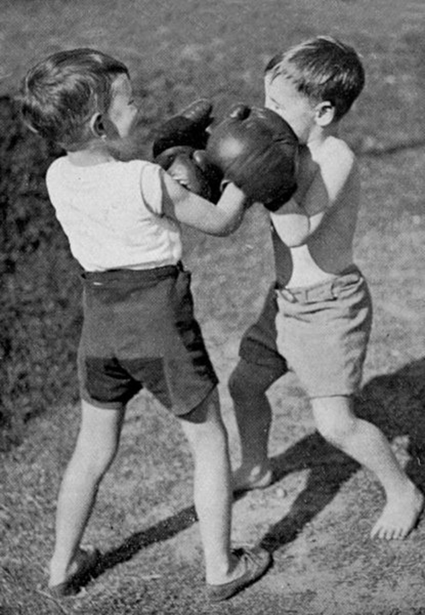 Children practicing their boxing skills at a young age, much like Billy Mashall and I. 