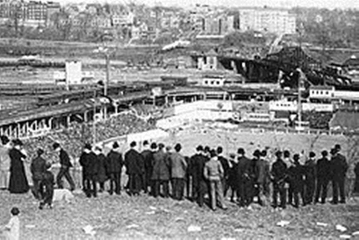 The Polo Grounds in its third incarnation, 1908.  The fans are viewing the game from Coogan's Bluff.