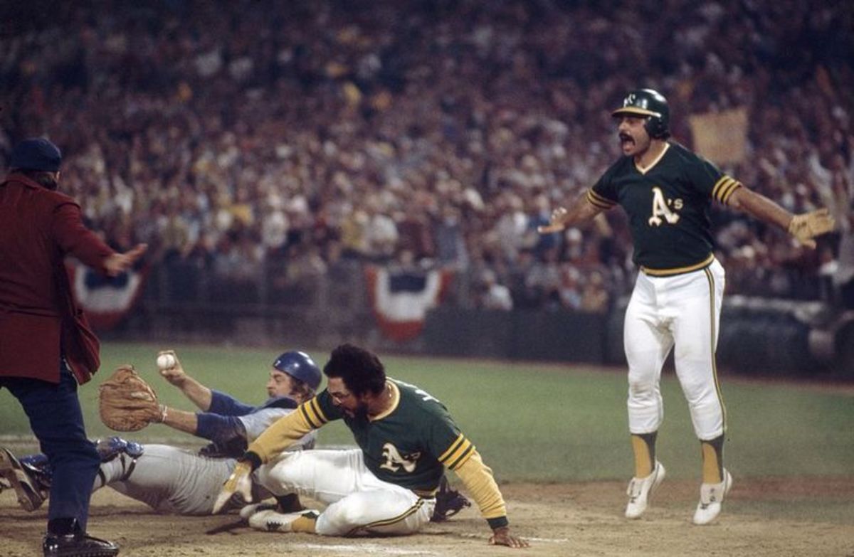 Game 4 - Reggie Jackson just beats Yeager's tag as Sal Bando jumps out of the way.