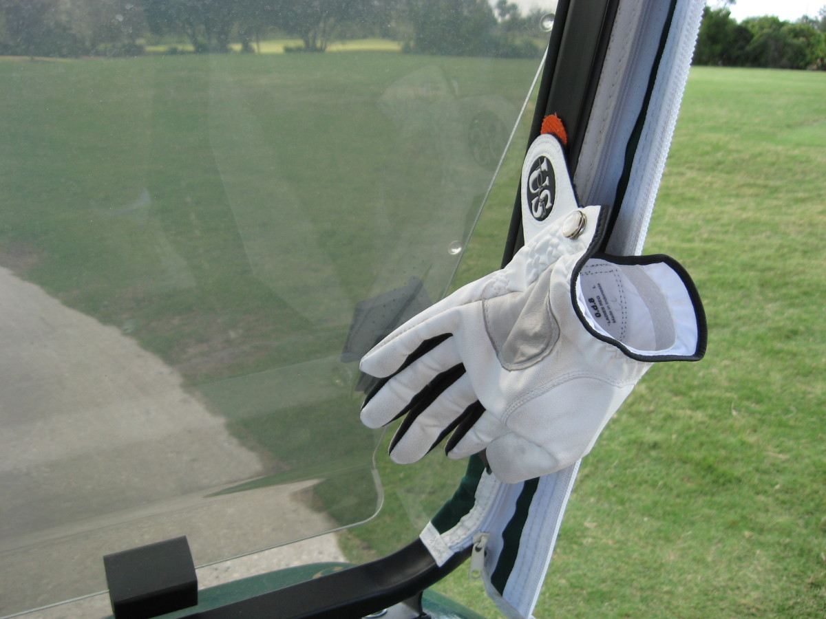 If you use your own cart on the course, attach a strip of velcro on the frame. This is a handy place to attach a glove to dry when you change gloves. I keep 3 on mine, ready to switch.