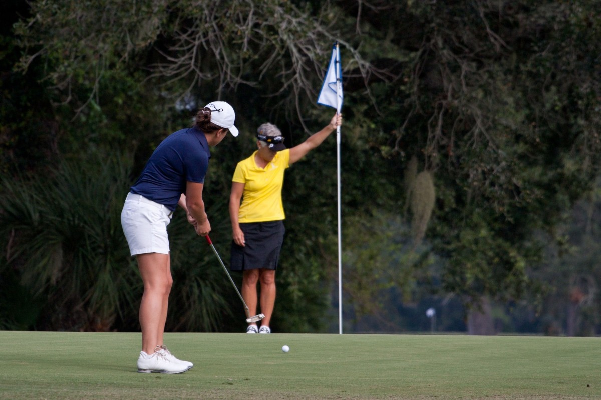 2019 golf rules allow you to leave the flag in the hold untended. If someone is holding the flag, they must pull it before the ball reaches it. 