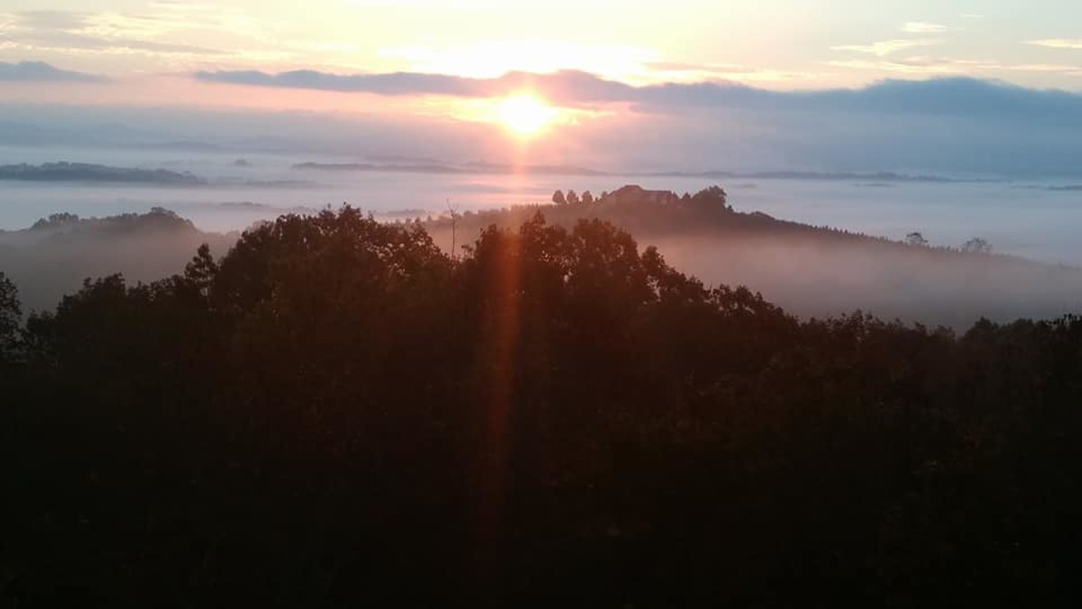 Sun rising over the Blueridge Mountains, symbolic of a new day with a forgiving heart.