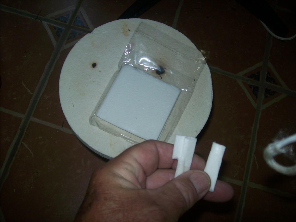 Ceramic paper rolled into little cylinders and placed inside cut off beer lips.