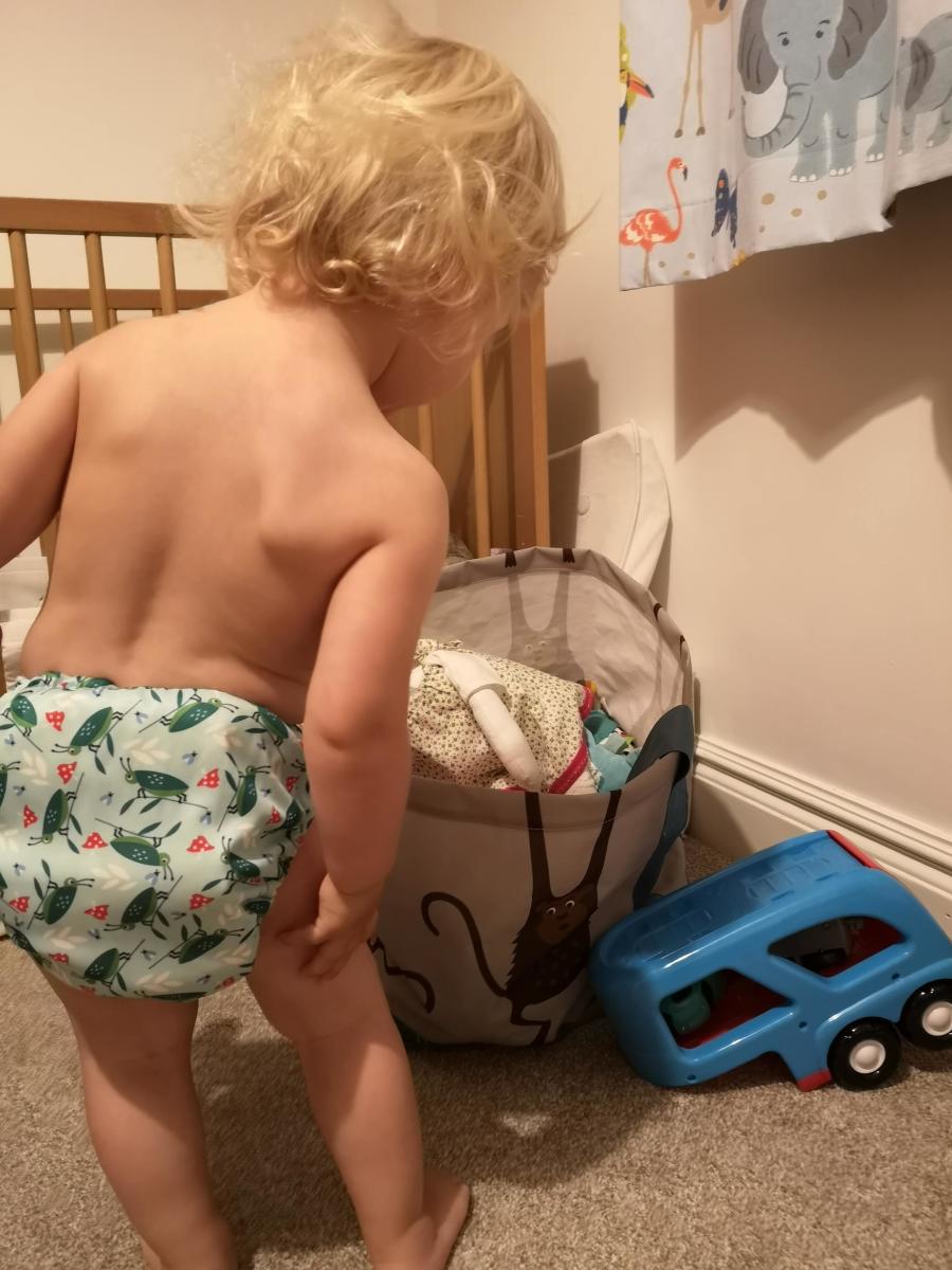 My daughter still wears hers at 18 months. This might even be the same nappy.