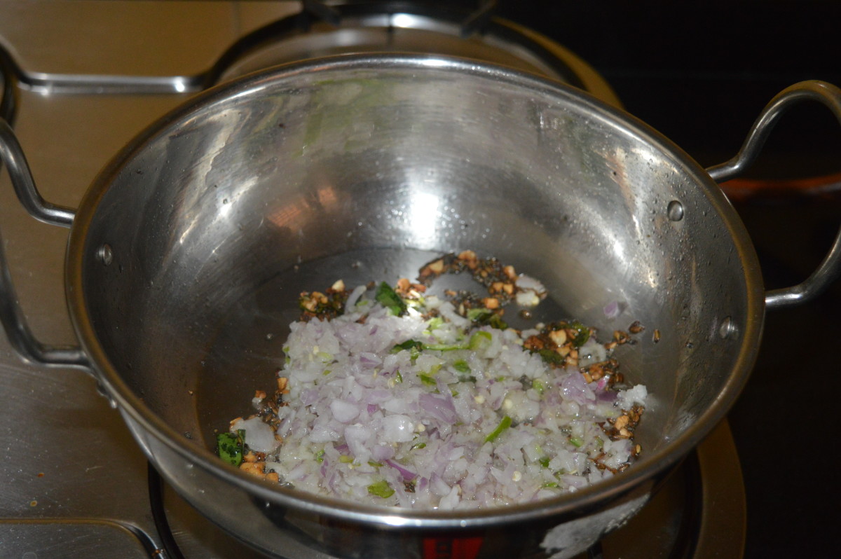 Add chopped onions and chopped green chilies