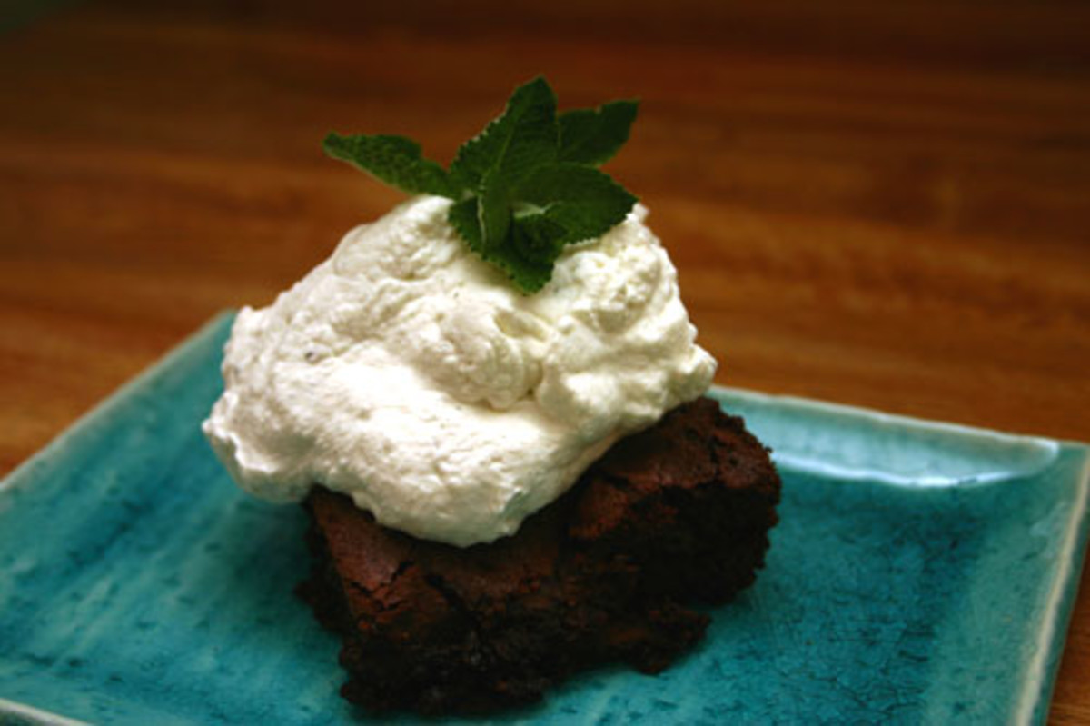 dark chocolate brownies topped with mint-infused whipped cream