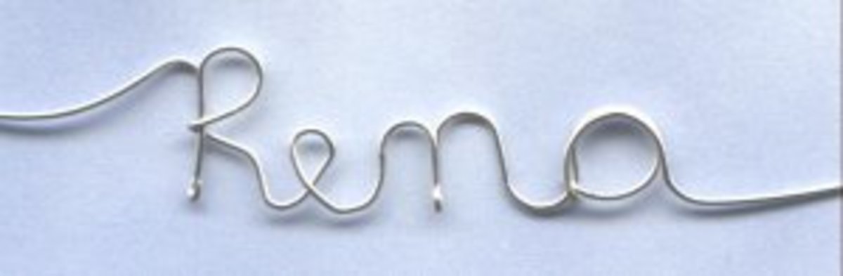 Writing my name with sterling silver wire and a pair of pliers