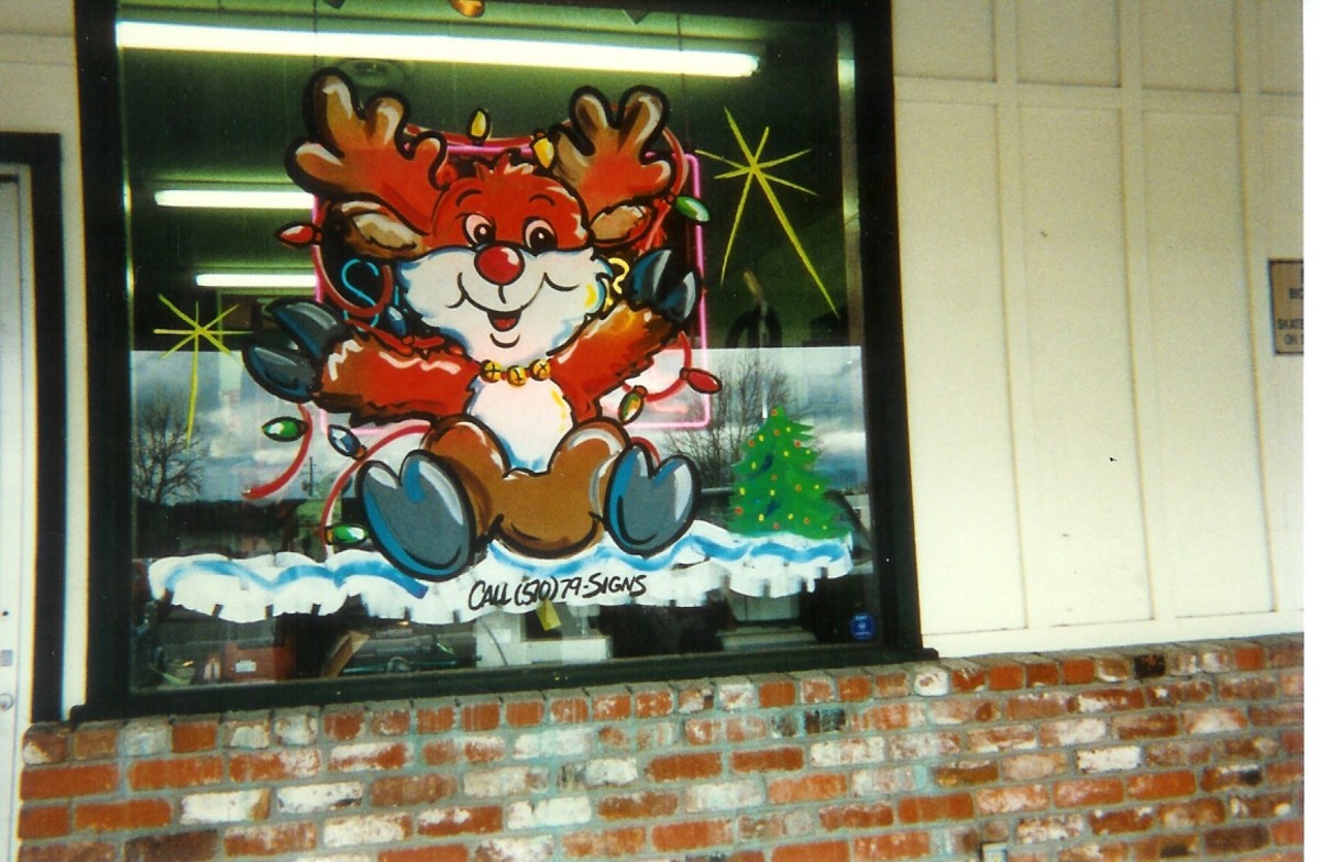 This little reindeer captured my heart, all tangled up in lights. Christmas window painting by Dorsi.