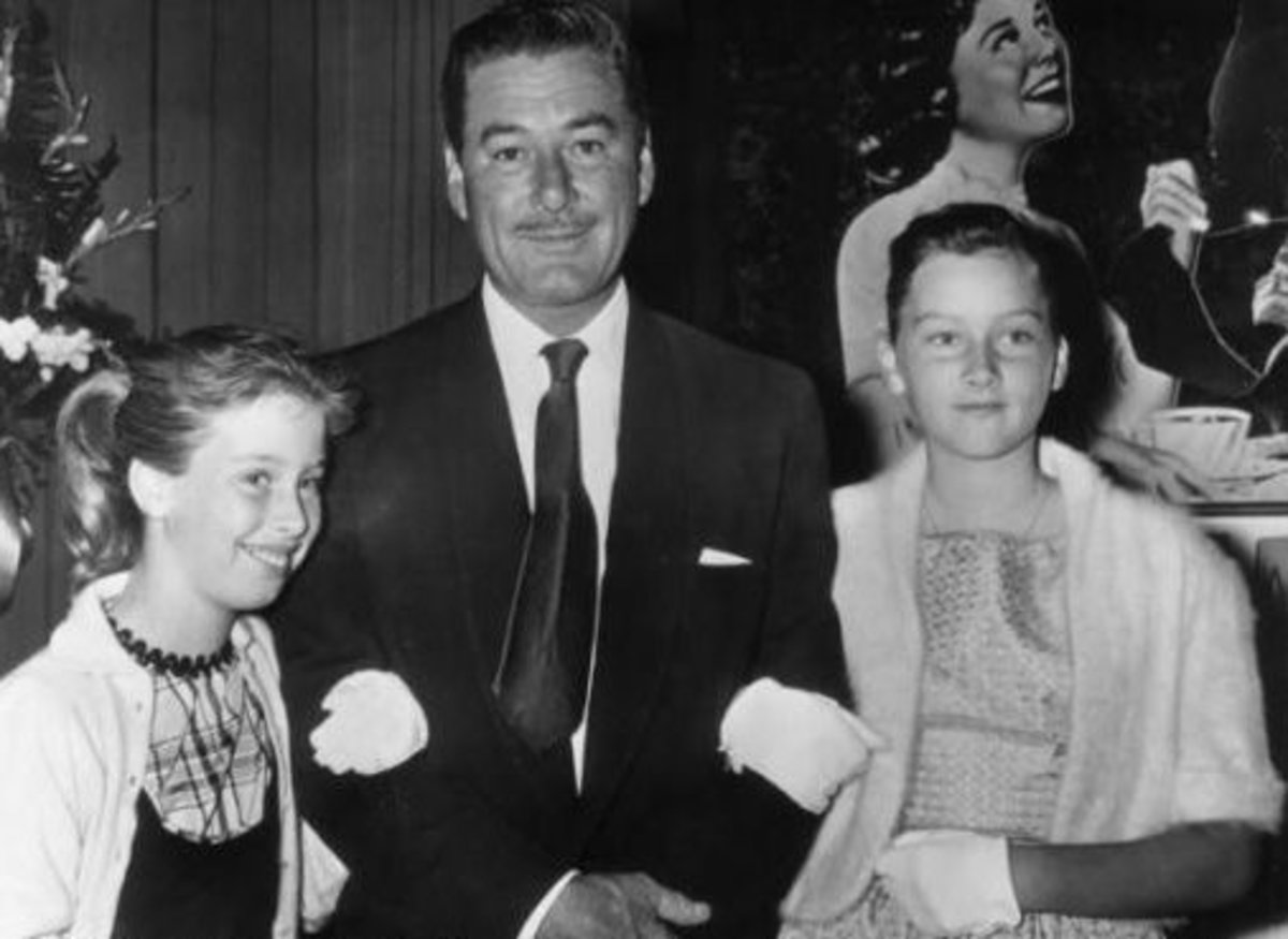 Flynn with his daughters, Rory(left) and Deidre