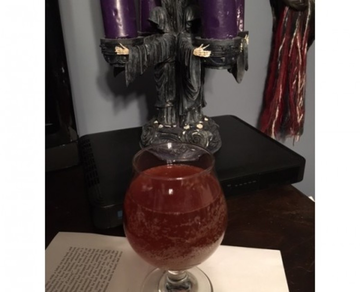 The author's own home brewed braggot (mead) with Halloween decorations in the background.