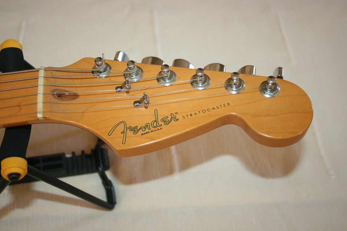 front view of nut and tuning pegs