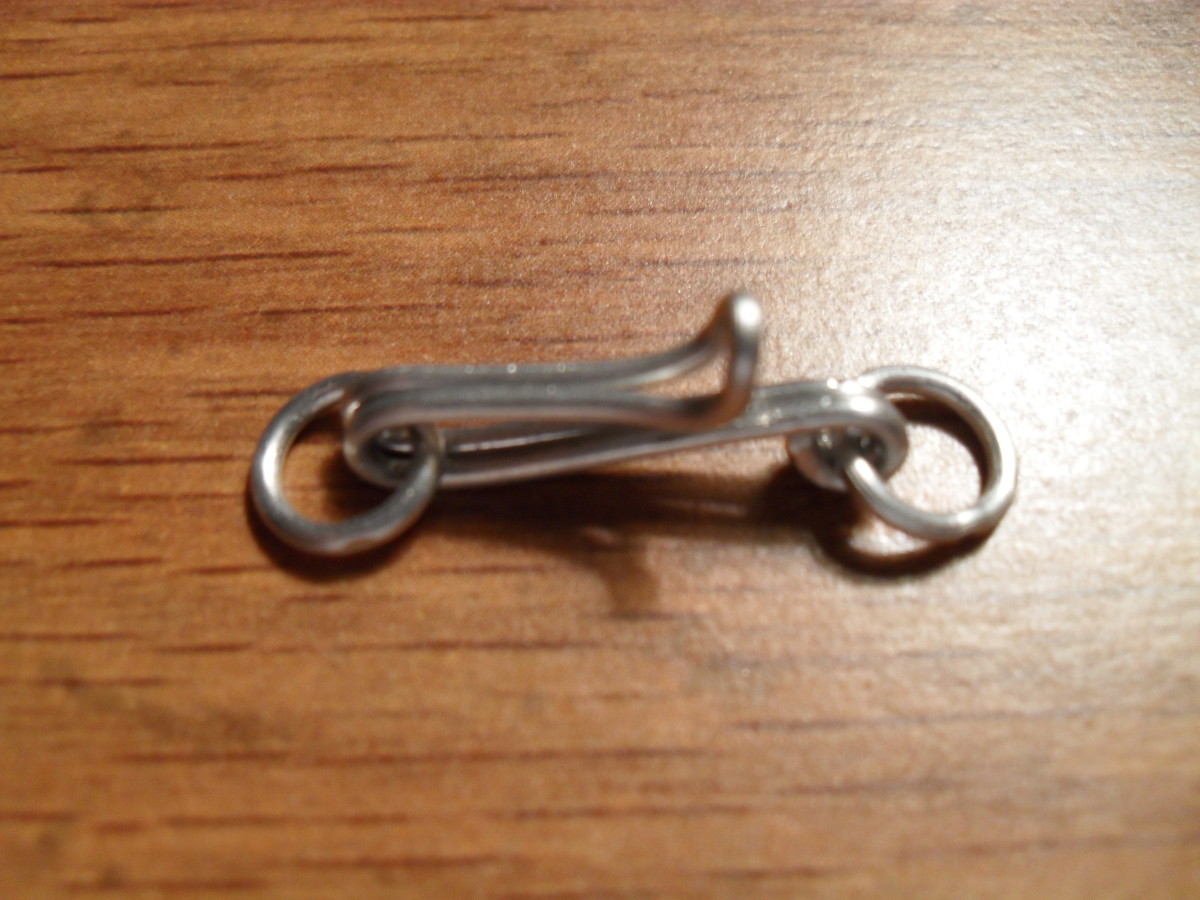 Make sure the hook will pass easily enough through the eye that goes on the other end of the chain. There you have a silver clasp for your silver necklace.
