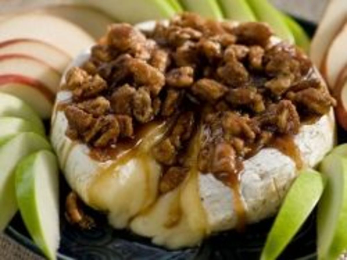 Paula Deen's Sugar and Nut Glazed Brie. Doesn't it look delicious?!