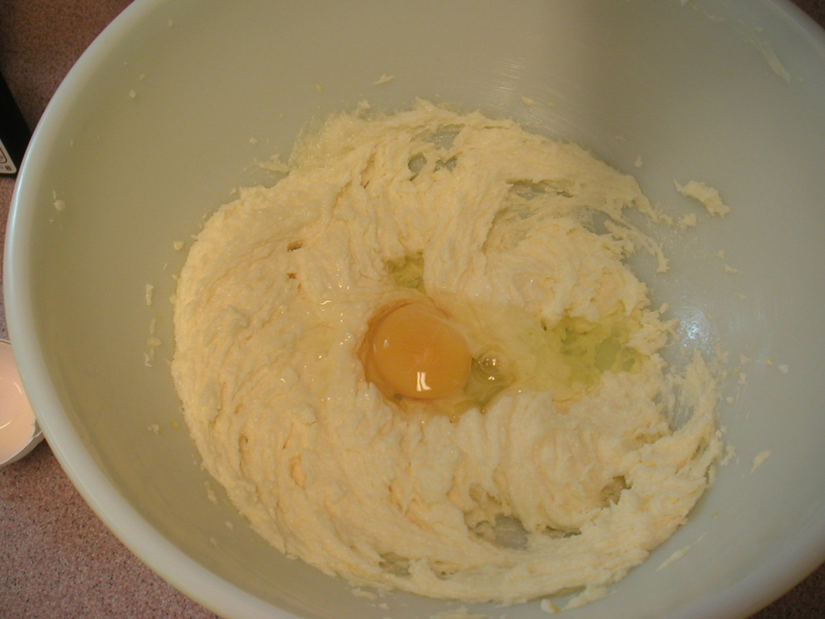 Cream the butter, add the sugar and mix until smooth. Add the eggs one at a time beating after each egg.
