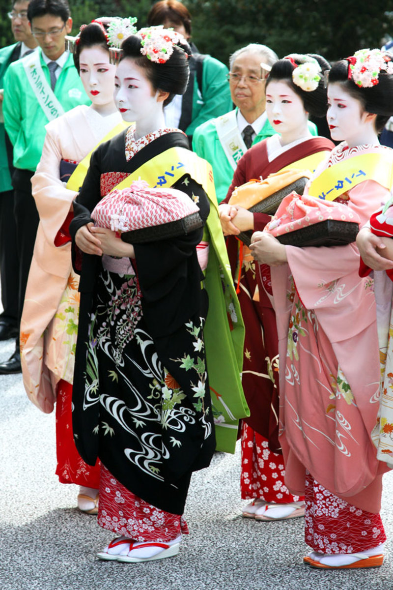 Maiko in the street of Kyoto city attending a social event