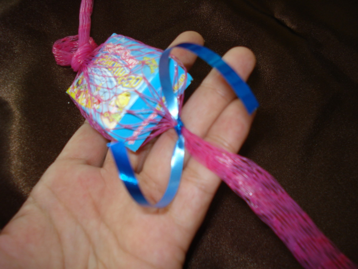 Tie off each candy with a piece of curling ribbon.