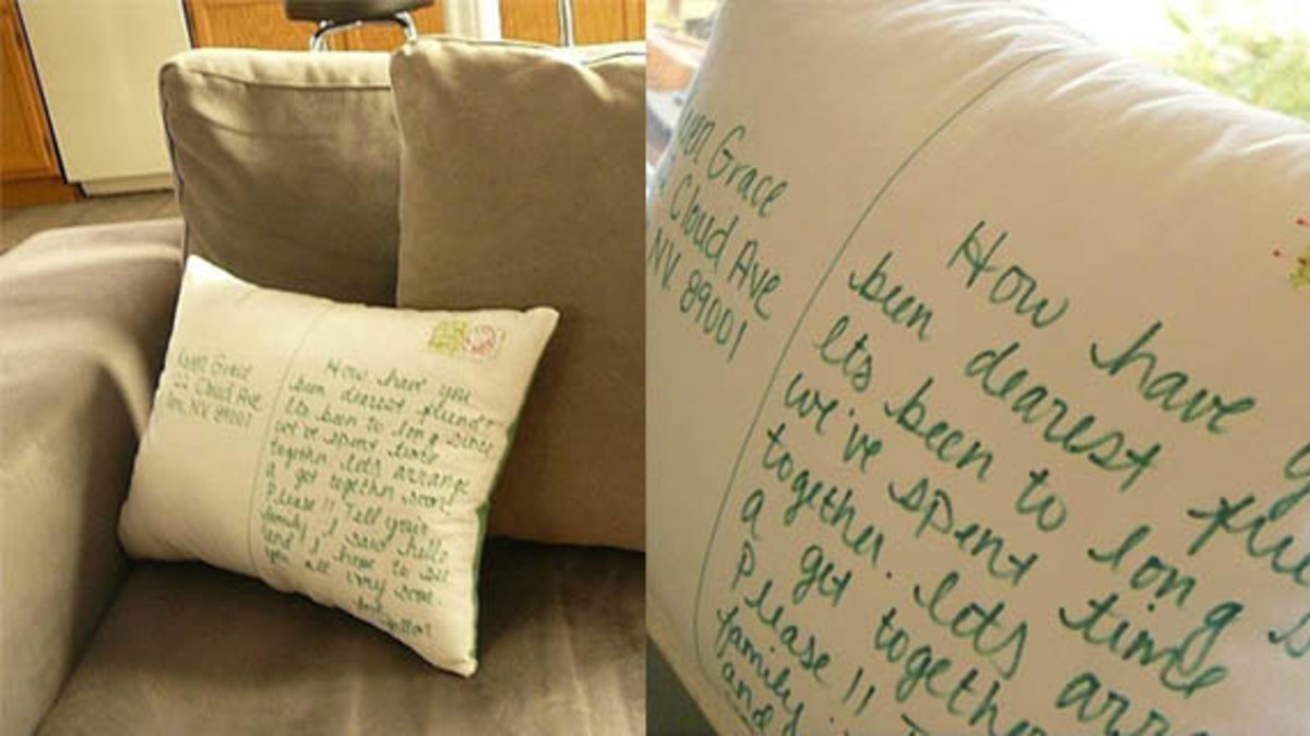 This postcard-themed throw pillow is functional and fashionable! 