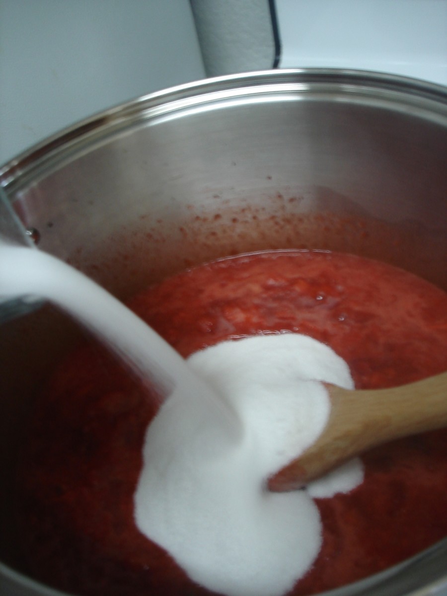 Step 3: As soon as the strawberry mixture is boiling, add the sugar all at once, stirring constantly.