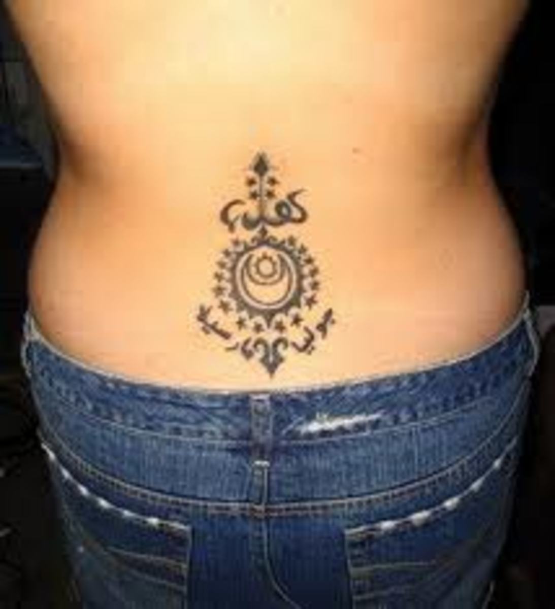 A creative lower back tattoo design