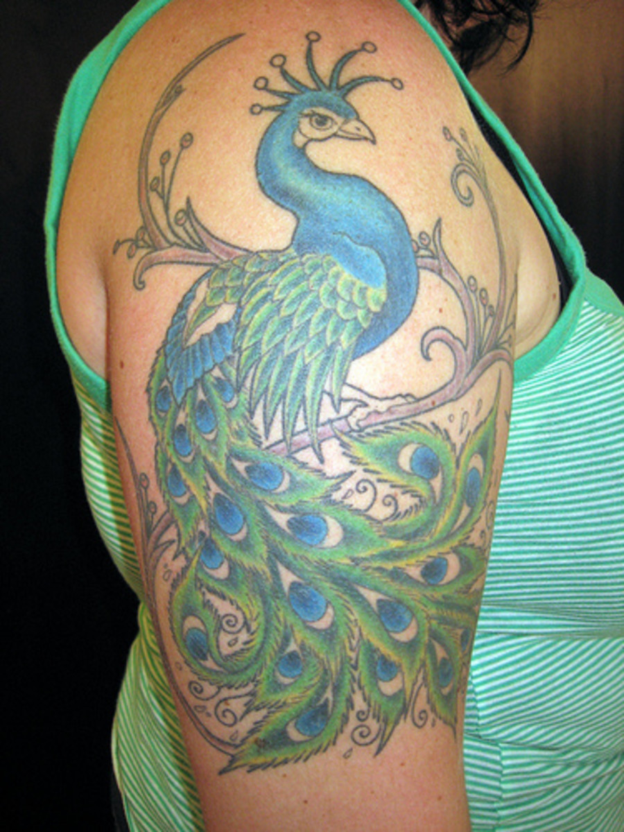 Peacock tattoo in hand