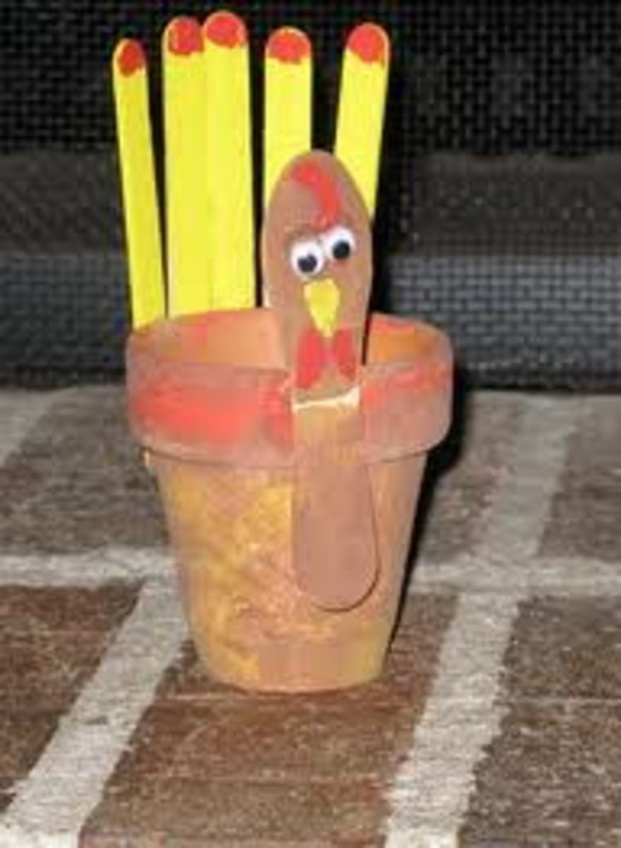 TURKEY FLOWER POT CRAFT MADE WITH POPSICLE STICKS, PAINT AND GOOGLE EYES