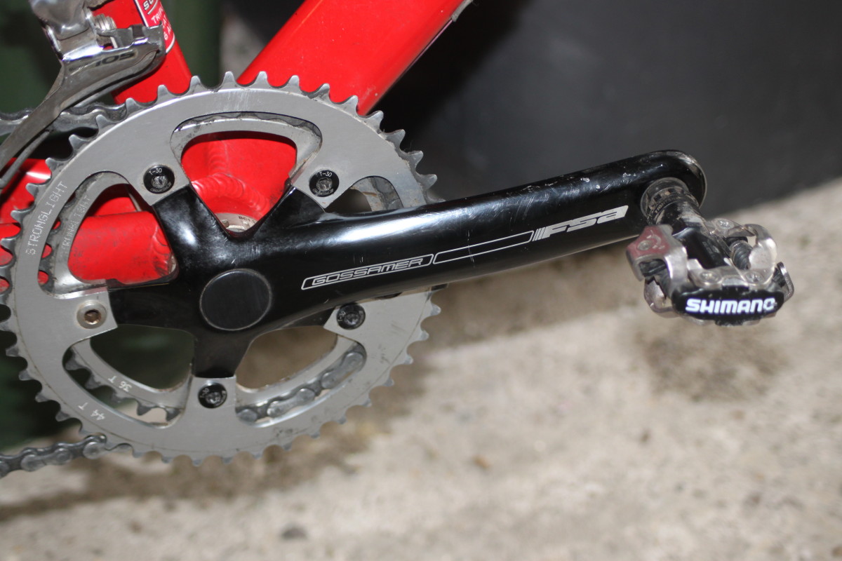 Cyclocross bike chainsets usually have smaller chainrings than road chainsets. Pictured is a 36-44 combination (you can just tell from the etchings) with MTB style pedals