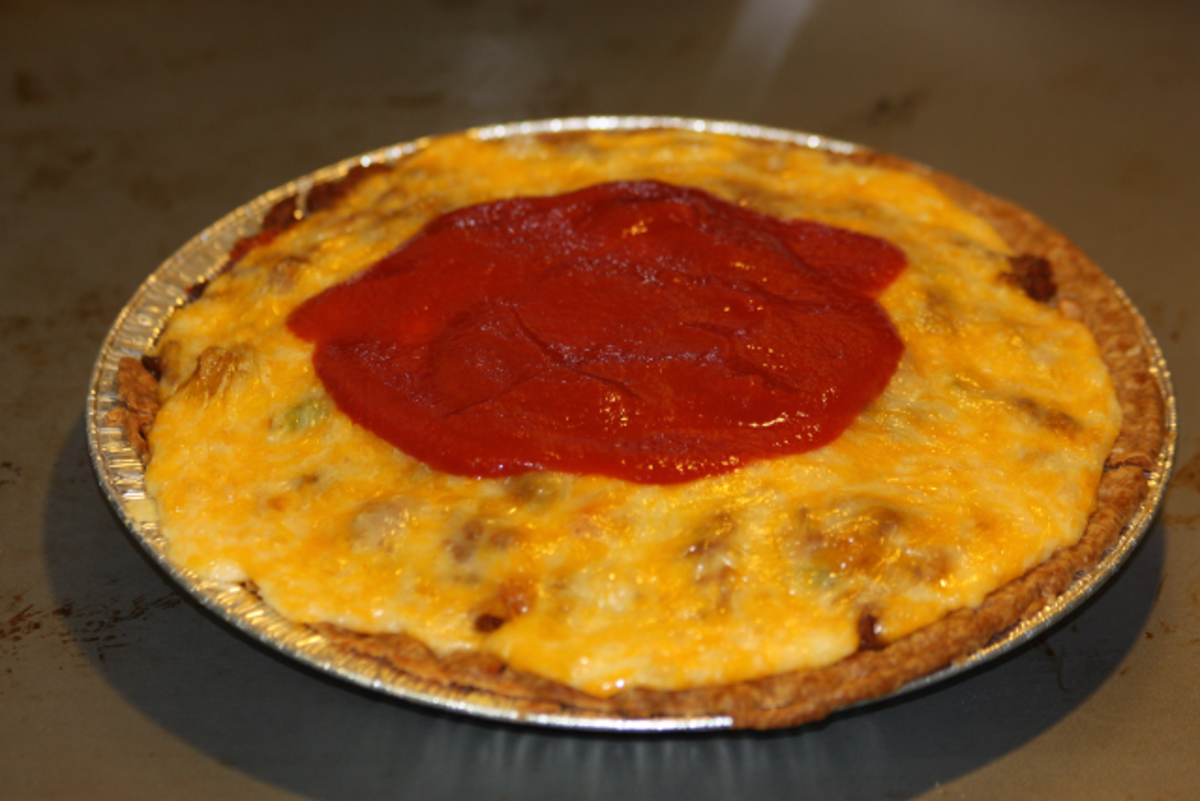 Add tomato sauce mixture to top once cheese is melted and serve!