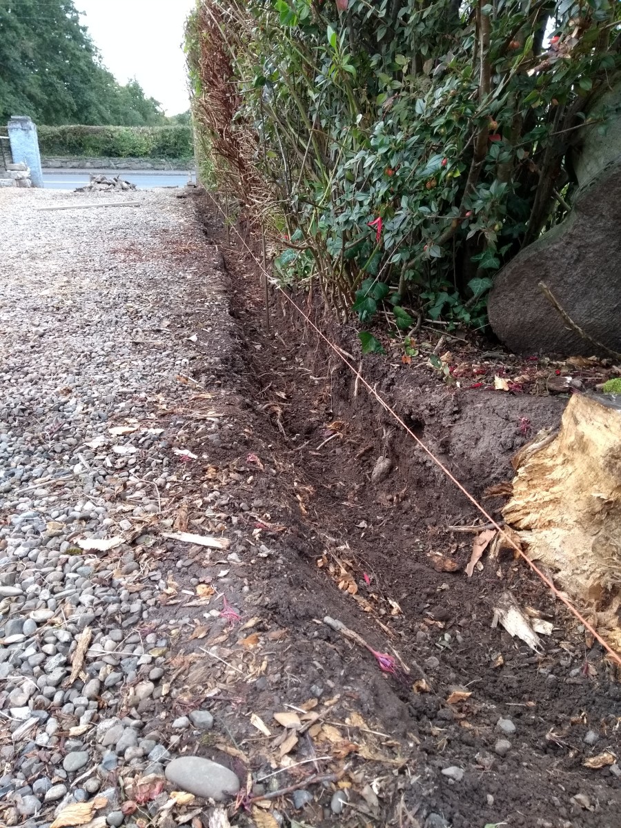 For 2 x 7 edging, dig a trench about 8 inches wide. Adjust the depth so that the underlying 2" to 3" bed of concrete will expose the desired amount of kerb above the surface.