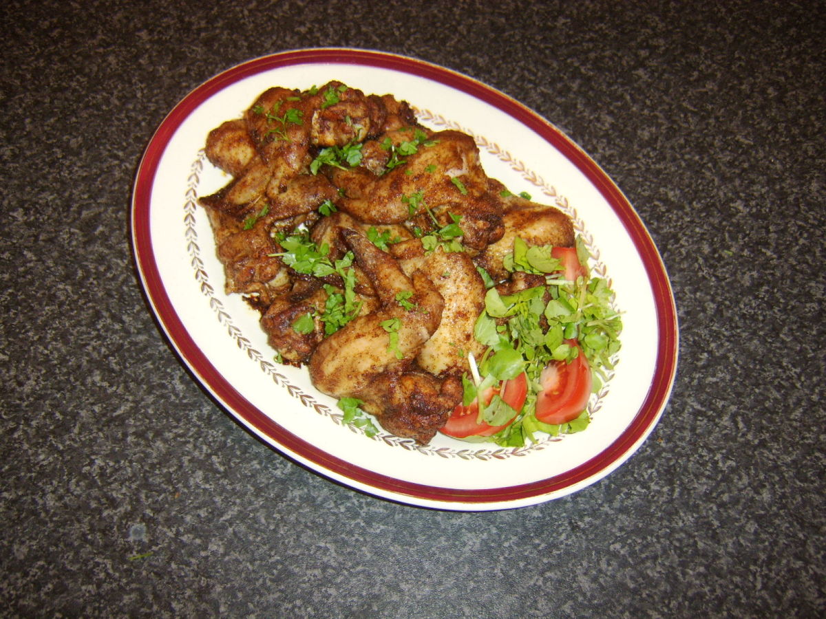 Chicken wings are roasted in a Lebanese 7 spice mixture and garnished with a simple salad