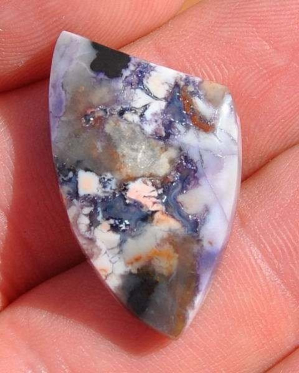 Tiffany Stone (Bertrandite) from Utah cut and polished by the author.