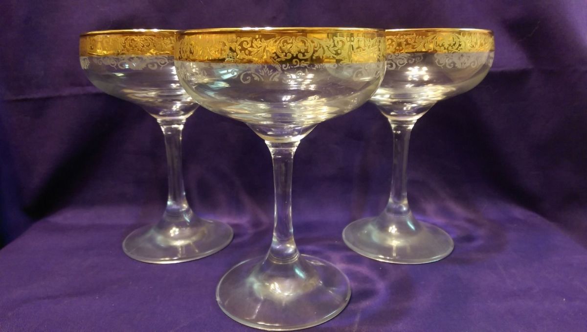 Here is a great example of three Cellini Crystal stemware Champagne glasses in  24 KT gold they were hand decorated Italy.