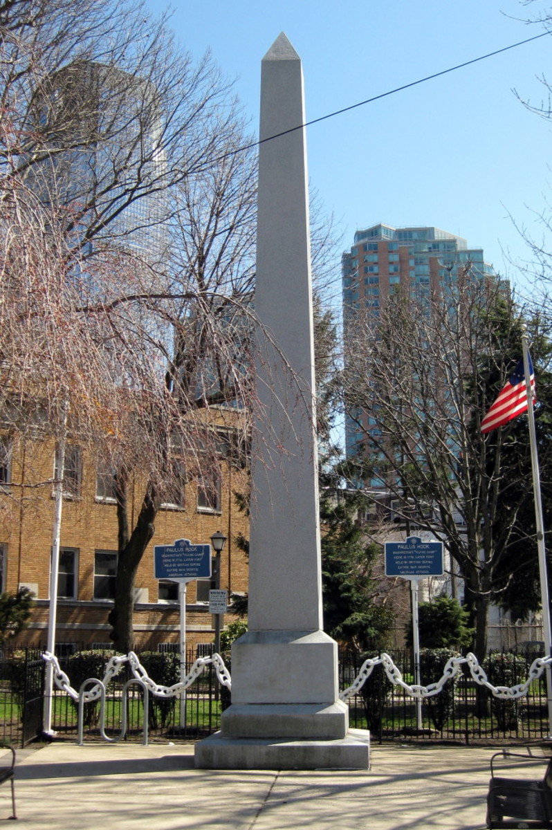 Obelisk to mark the site of the Battle of Paulus Hook August 19, 1779. A granite obelisk at the corner of Washington and Grand Street in Jersey City, erected in 1903 by the Daughters of the American Revolution.
