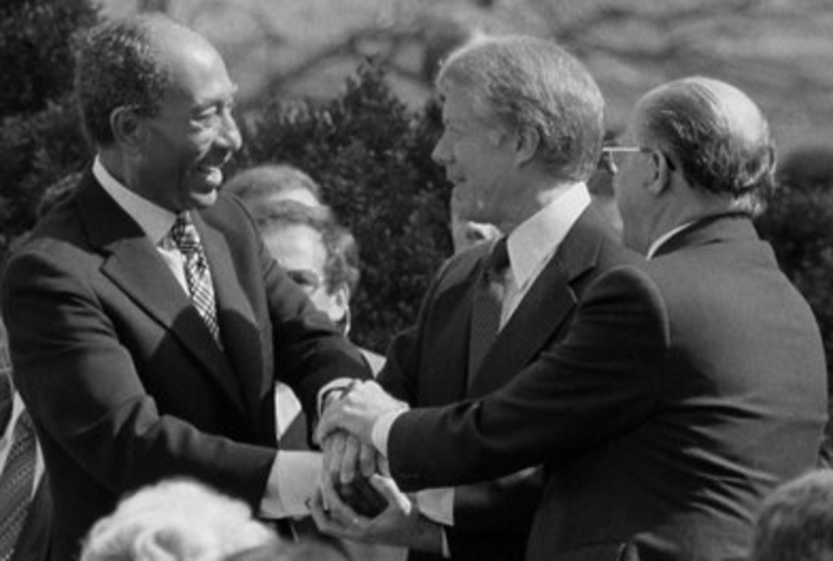 Egyptian President Sadat, U.S. President Carter and Israel Prime Minister Begin Shake Hands after Signing the Israel/Egypt Peace Treaty in Washington D.C. on March 26, 1979